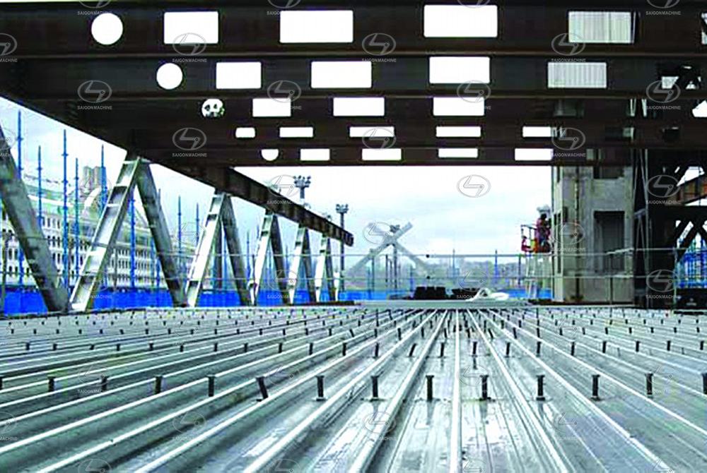 Máy cán tôn sàn Deck | Máy đổ sàn - H45 | H50 | H71 sản xuất thành các tấm sàn Deck được hiểu như là tấm sàn bằng tôn thép được liên kết trên hệ dầm k